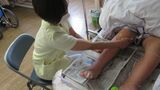 愛媛県今治市・美須賀病院が行う、患者に手で触れる看護を重視したケア「て・あーて」とは？（写真：筆者撮影）