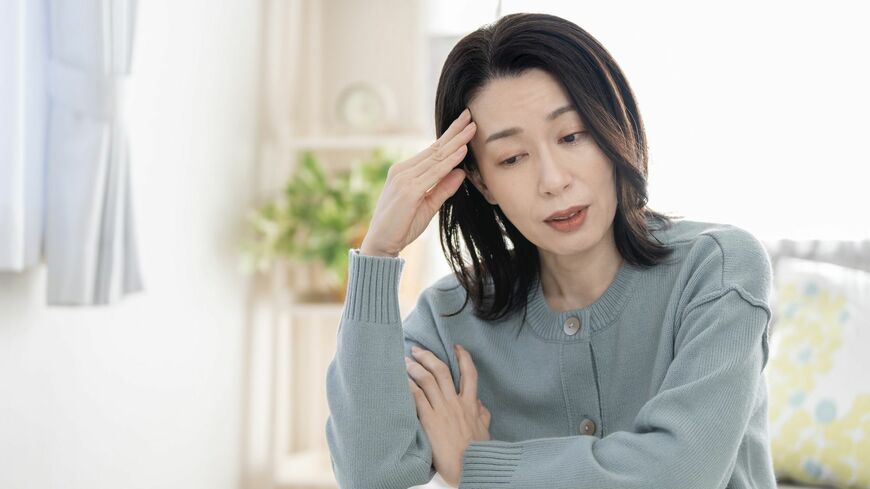 体調不良の女性