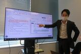 AI契約書審査について説明する最大手リーガルオンテクノロジーズの角田望社長（2022年10月26日、写真：筆者撮影）