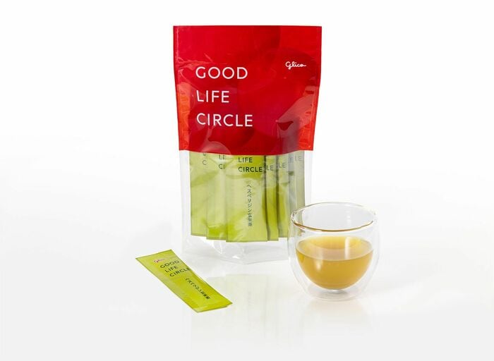 袋に内包された非売品のヘスペリジン玄米茶（オンラインプログラム用）