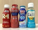 左から食品表示上の発酵乳（ヨーグルト）、乳製品乳酸菌飲料、乳酸菌飲料、清涼飲料水。種類は異なるが、容量やデザインの雰囲気は似ている（記者撮影）