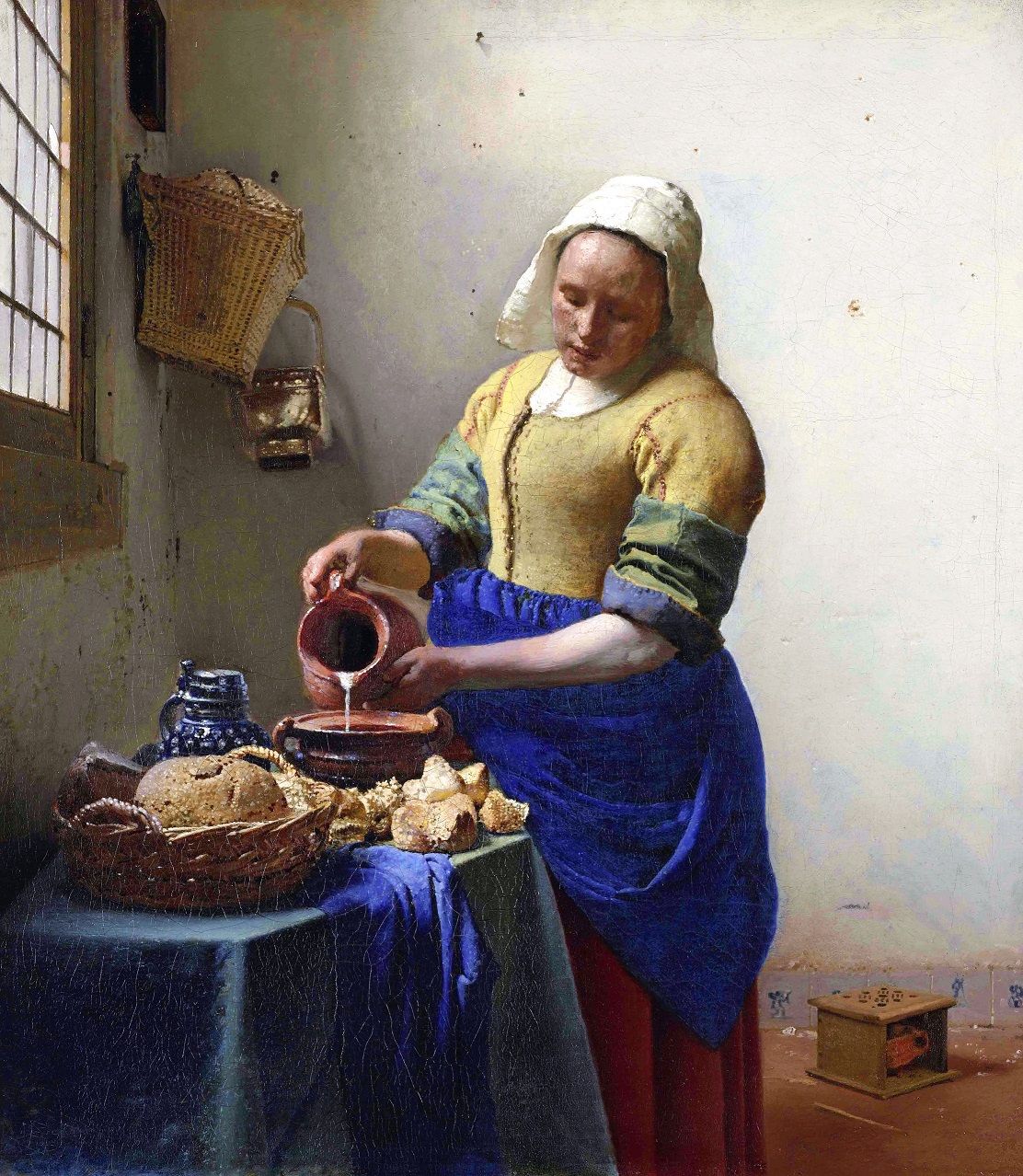 フェルメール《牛乳を注ぐ女》（1657年頃）