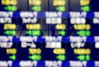 日経平均604円安､キャタピラーショック警戒