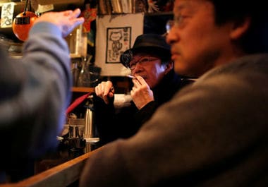 Japan wrestles over smoking ban as Olympics loom