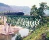 第六只見川橋梁を渡るC11形牽引の貨物列車。豪雨後の