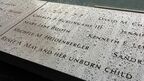 「AND HER UNBORN CHILD」の文字が