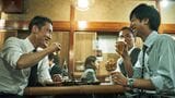 居酒屋で話す、上司と部下