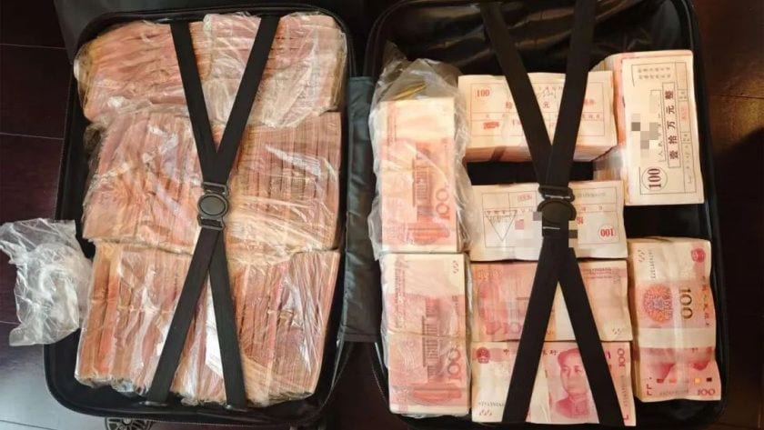 韓容疑者らは受け取った金銭を複数の賃貸住宅に分散して隠していた（写真は上海市公安局経済犯罪偵査総隊が隠し先から押収した現金）