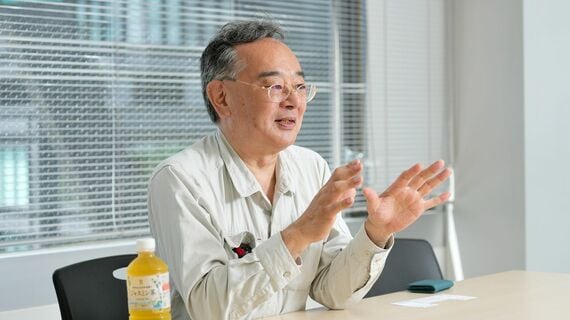 作業服の石川英一さん
