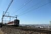 奈良線の電車と大阪平野