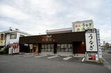 「美濃金 春日井店」外観。店は多くの車が行き交う国道19号線沿い（筆者撮影）