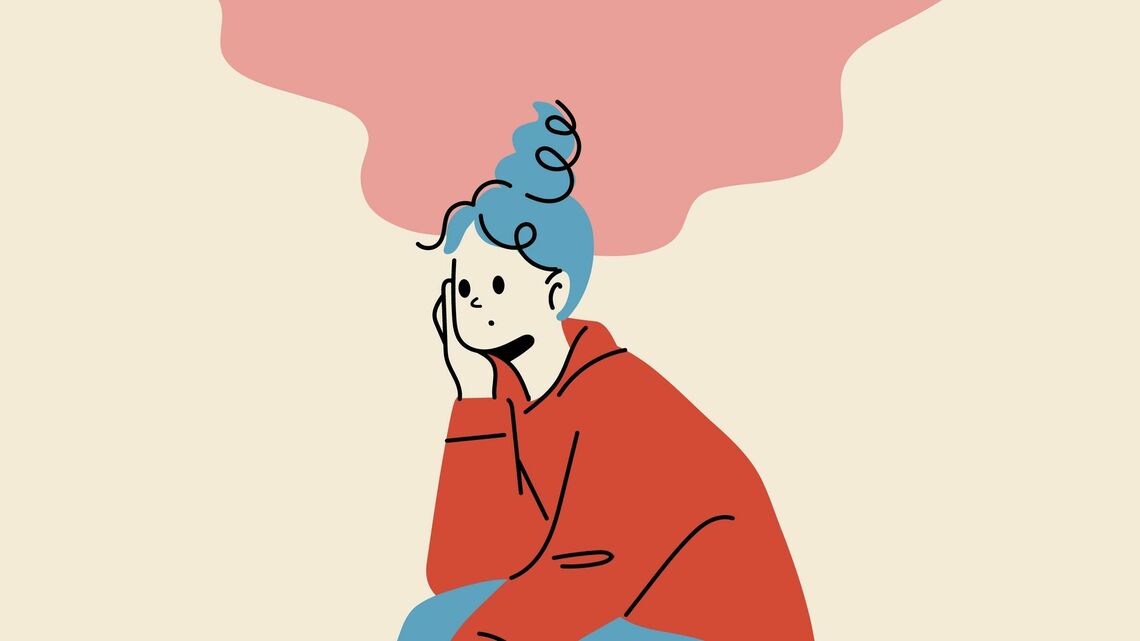 椅子に座って考え事をしている女性