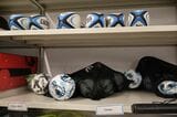 体育館の用具室にはラグビーボールもある