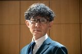 執行役員広報室長の田中国男さん（写真提供：ケンミン）