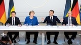 2019年12月9日、フランス・パリで開催されたウクライナに関する4カ国協議。ウクライナのゼレンスキー大統領（左）とロシアのプーチン大統領（右）が同席している（写真・2019 Bloomberg Finance LP）