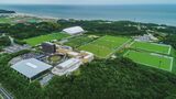 福島県楢葉町と広野町にまたがるサッカーのナショナル・トレーニング施設Jヴィレッジ。高濃度の放射性物質で汚染された廃棄物が秘かに保管されていることがわかった（株式会社Jヴィレッジ提供、写真：時事）