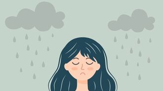 曇り空と憂鬱な女性